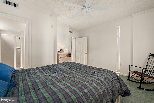 carpeted bedroom featuring visible vents, a textured ceiling, and crown molding