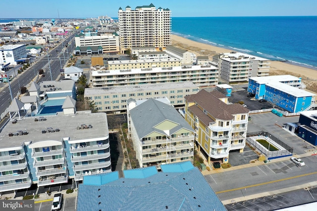 birds eye view of property with a city view, a beach view, and a water view