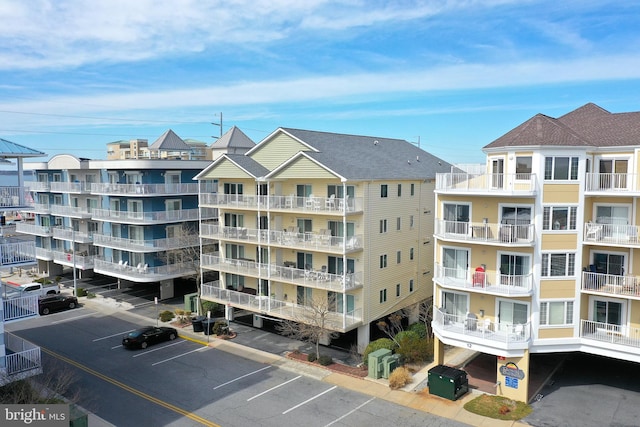 view of property featuring uncovered parking