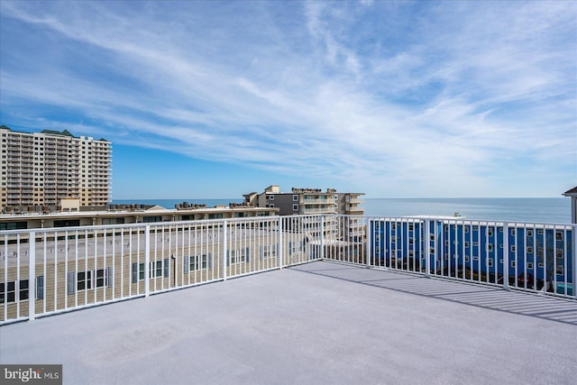 view of patio with a water view