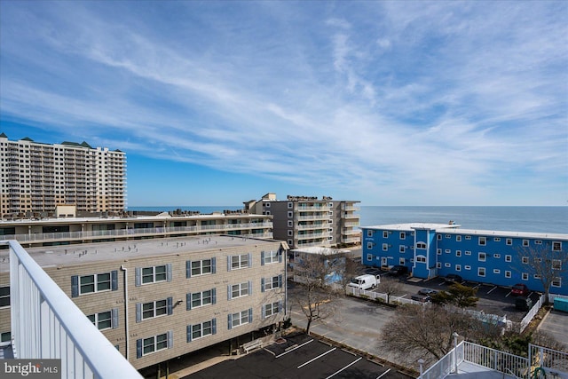 exterior space with a city view and a water view