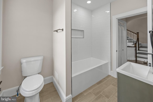 full bath with vanity, toilet, baseboards, and wood tiled floor