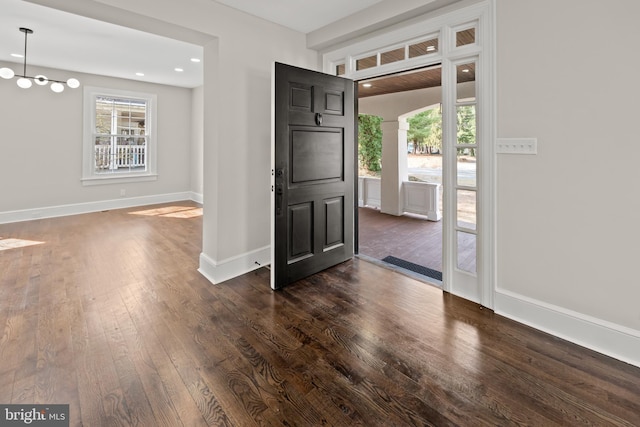 entrance foyer featuring recessed lighting, baseboards, and dark wood-type flooring