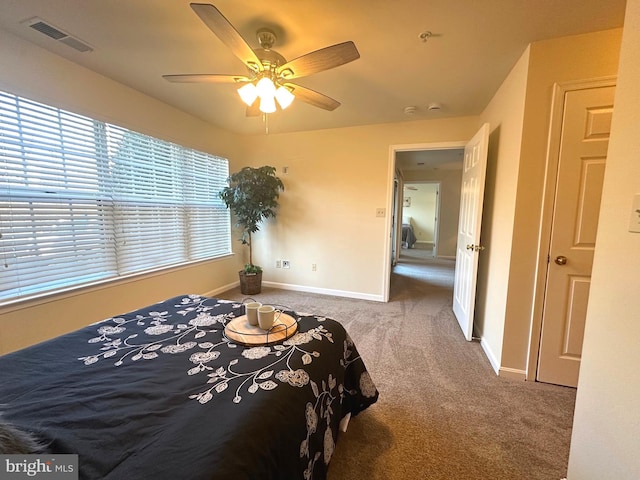 bedroom with visible vents, baseboards, carpet, and ceiling fan