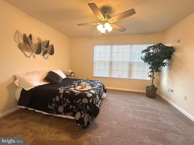 carpeted bedroom with baseboards and a ceiling fan