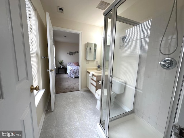 ensuite bathroom with vanity, visible vents, a stall shower, ensuite bathroom, and toilet