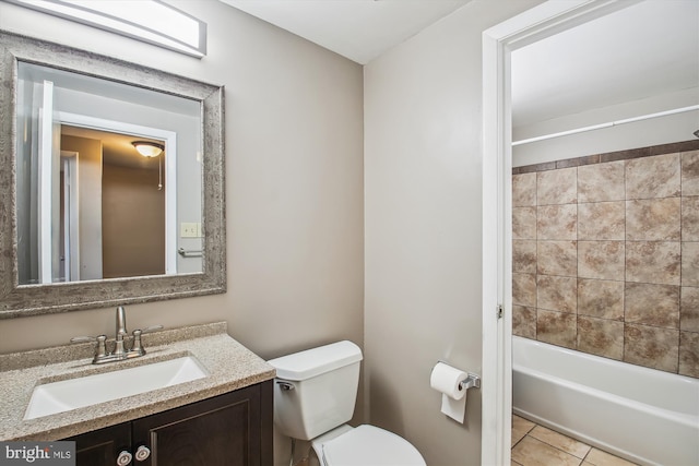 full bathroom featuring tile patterned floors, toilet, vanity, and  shower combination