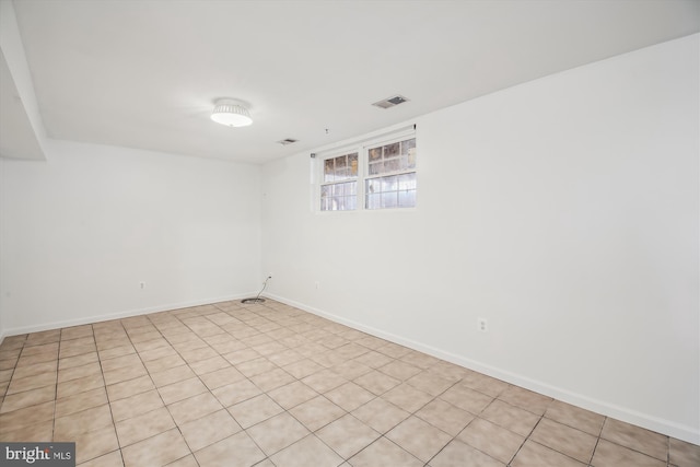 unfurnished room featuring visible vents and baseboards