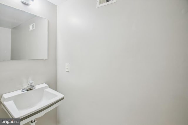 bathroom with a sink and visible vents