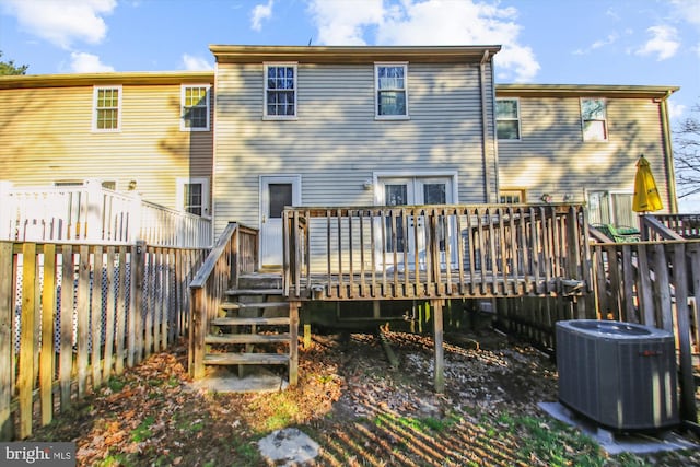 back of house featuring a deck, central AC, and fence