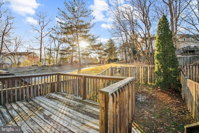 deck featuring fence and a residential view