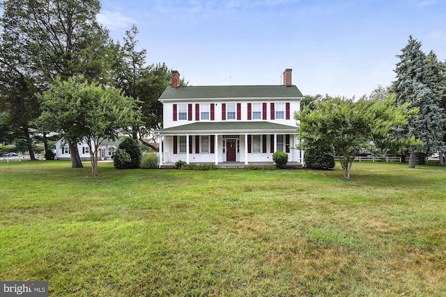 view of front of house featuring a porch and a front lawn