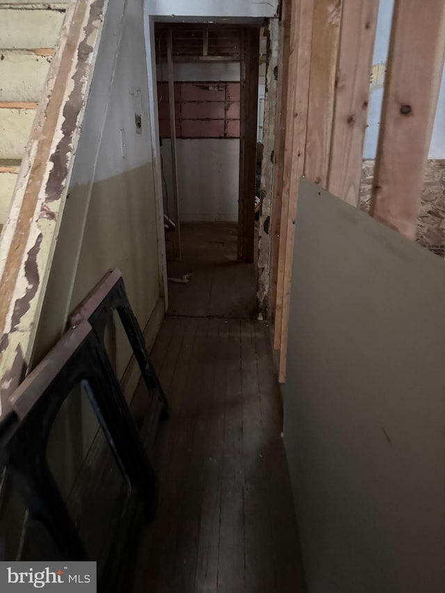 hallway with hardwood / wood-style floors