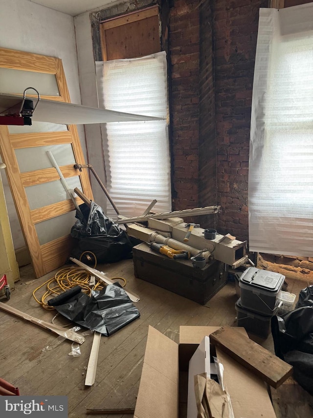 miscellaneous room featuring plenty of natural light and hardwood / wood-style flooring