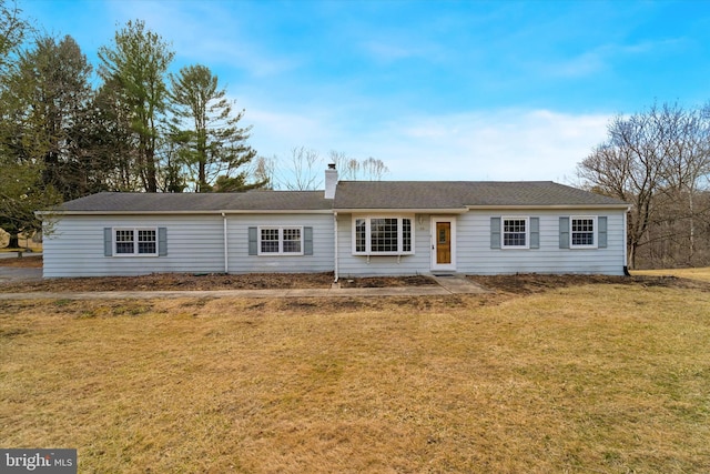 single story home featuring a front yard and a chimney