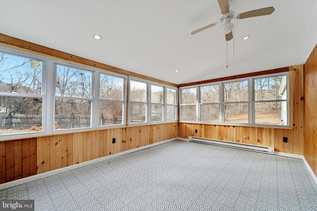 unfurnished sunroom with a baseboard heating unit, vaulted ceiling, and a ceiling fan