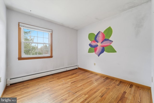 unfurnished room with light wood-type flooring, a baseboard radiator, and baseboards