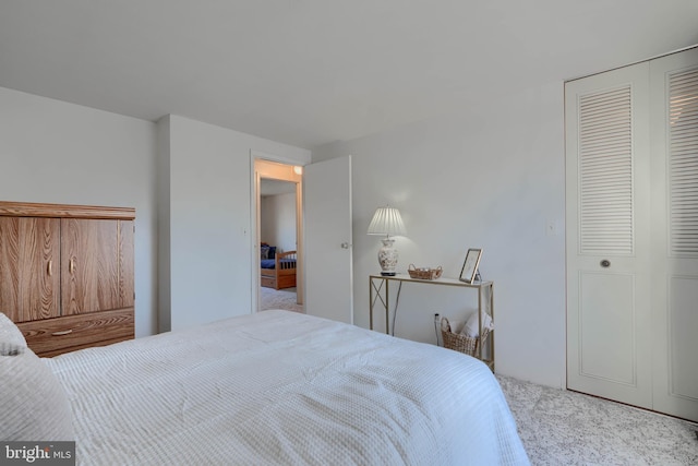 bedroom with a closet and carpet floors