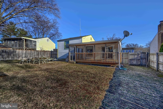 rear view of property with a fenced backyard