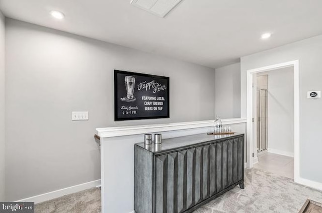 interior space featuring visible vents, recessed lighting, carpet, and baseboards