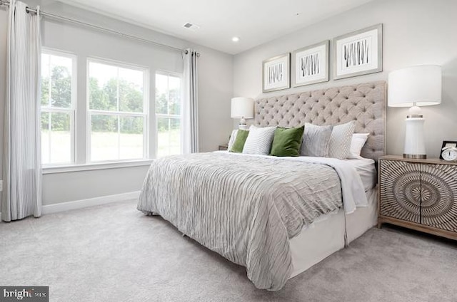 bedroom featuring visible vents, recessed lighting, baseboards, and carpet