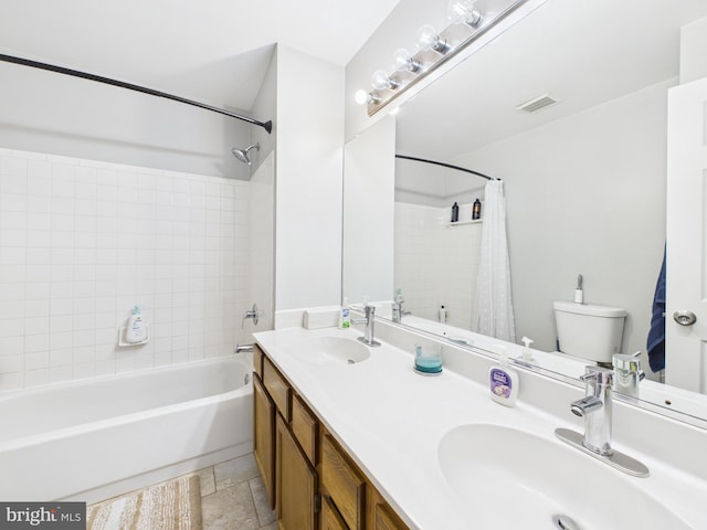 full bathroom with visible vents, toilet, shower / bath combo with shower curtain, and a sink