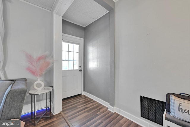 entryway featuring visible vents, baseboards, and dark wood-style flooring