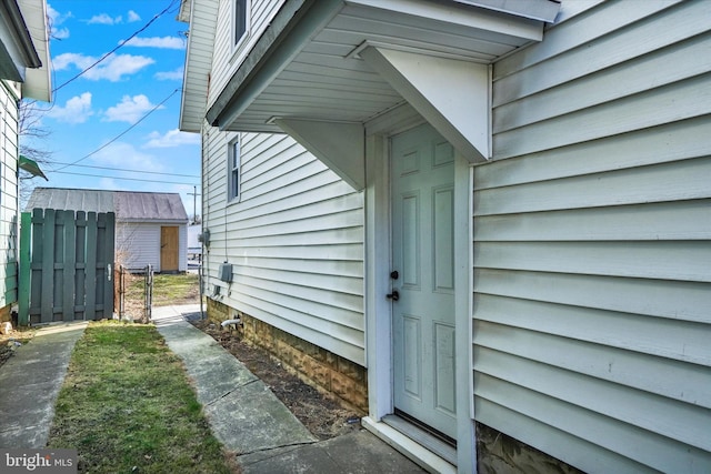 view of property exterior featuring a gate and fence