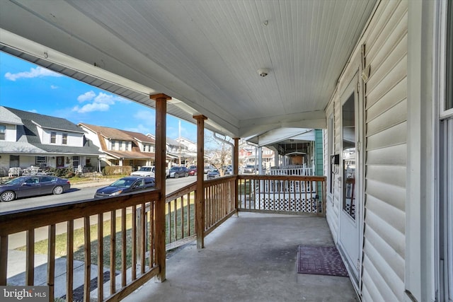 balcony with a residential view and covered porch