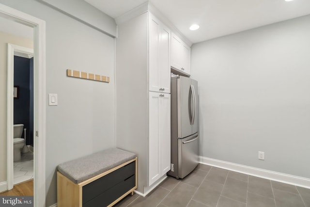 mudroom with baseboards and recessed lighting