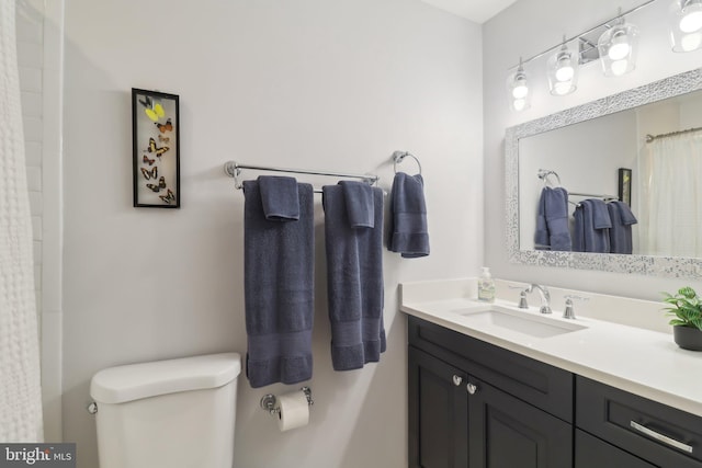 full bath with vanity and toilet