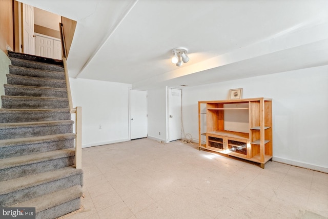 interior space with tile patterned floors and baseboards