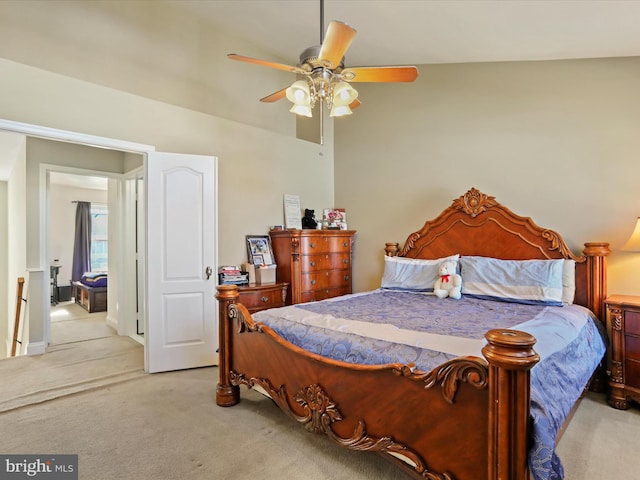 bedroom featuring light colored carpet and a ceiling fan