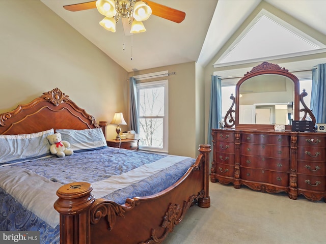 bedroom with carpet, ceiling fan, and vaulted ceiling