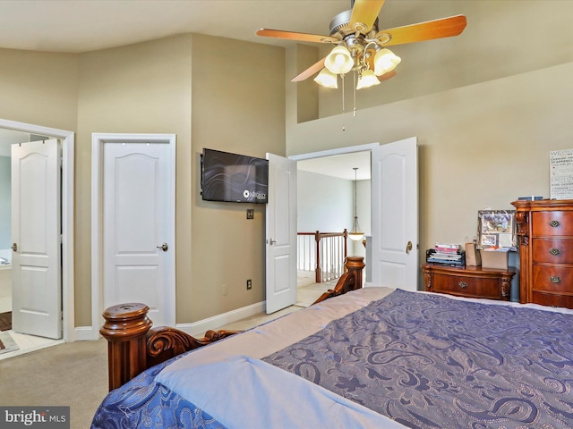 bedroom with baseboards, carpet, and a ceiling fan