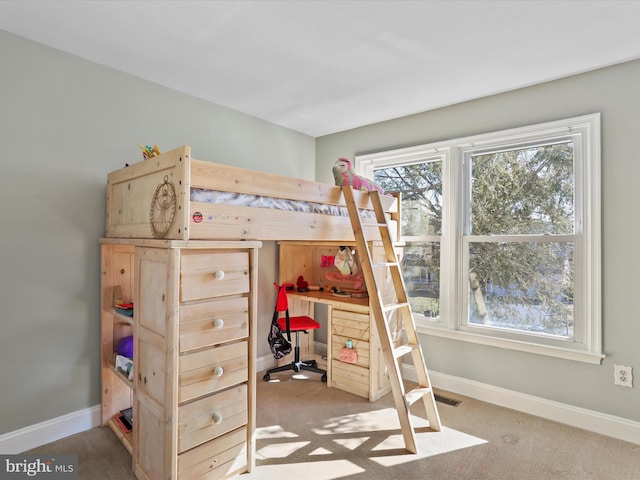 carpeted bedroom featuring visible vents and baseboards