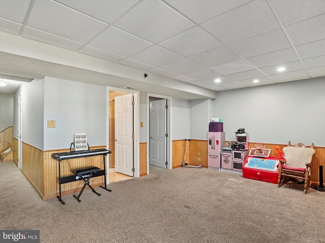 rec room featuring a wainscoted wall, recessed lighting, carpet, wood walls, and a paneled ceiling