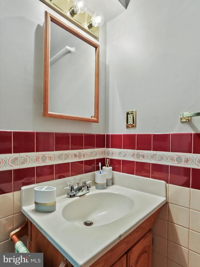 bathroom featuring tile walls and vanity