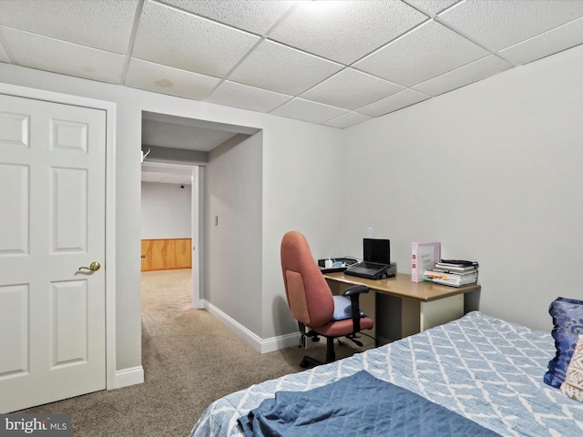 bedroom with baseboards, a paneled ceiling, and carpet flooring