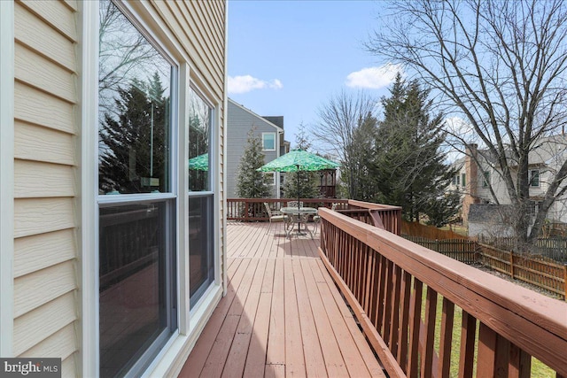 wooden terrace with outdoor dining area