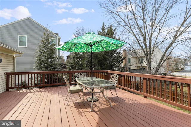 wooden terrace featuring outdoor dining space