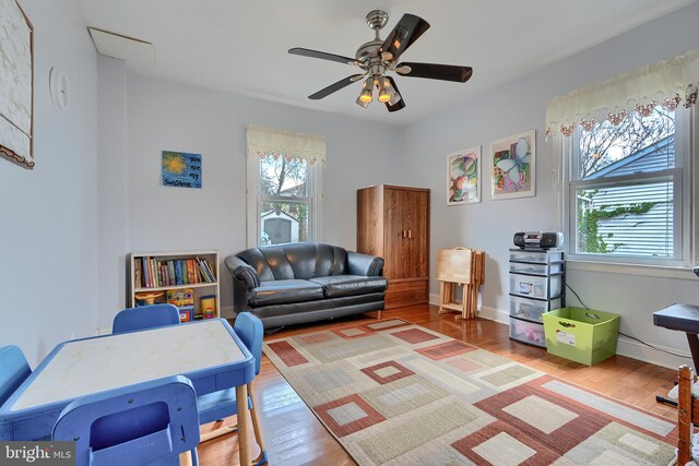 interior space with ceiling fan and wood finished floors