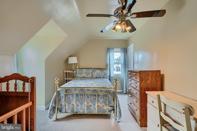 bedroom with a ceiling fan, lofted ceiling, carpet, and baseboards