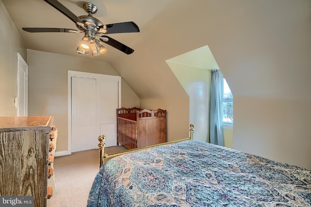 bedroom with carpet, ceiling fan, and vaulted ceiling