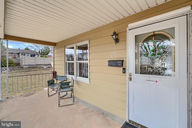 doorway to property featuring a porch