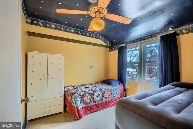 bedroom with lofted ceiling and carpet