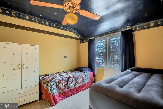 bedroom featuring lofted ceiling and carpet floors