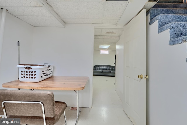 office area with a drop ceiling