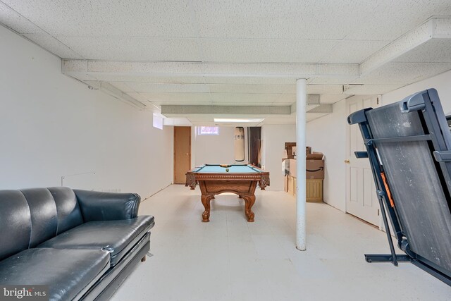 recreation room with pool table, tile patterned floors, and a paneled ceiling