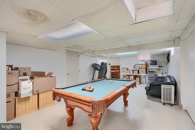 playroom featuring a drop ceiling, light floors, pool table, and radiator heating unit